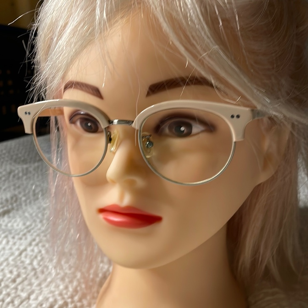 Cat eye pink and silver eyeglass frames with prescription lenses